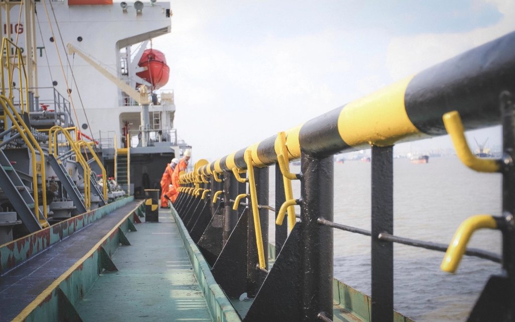 Product tanker alongside at a fuel terminal